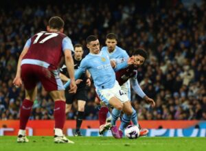 Foden hat-trick keeps Man City in thick of title race